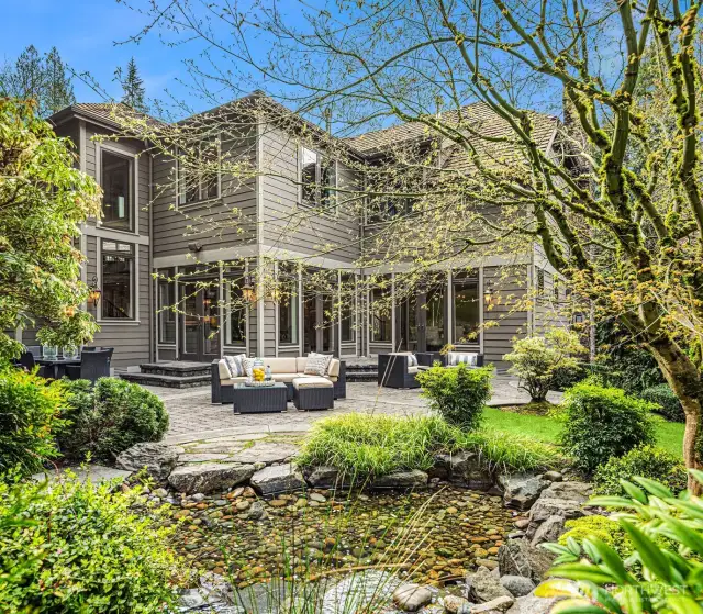 Entertainment-sized terrace with hand-set pavers, and flagstone pathways