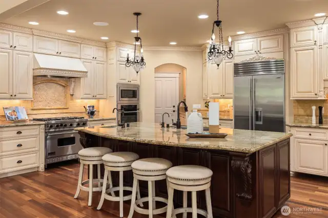 Epicurean inspired Kitchen with custom glazed cabinetry and granite counters