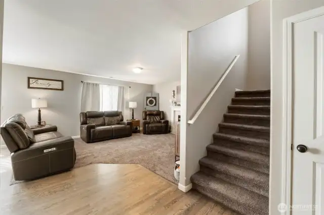 Beautiful hardwood floors guide you to the center of the home and into the great room. Stairs lead you up to the Primary suite, 4 guest bedrooms and a large bonus room.