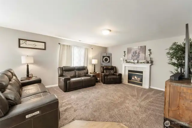 Stay connected with your guests in the open family room with cozy gas fireplace.