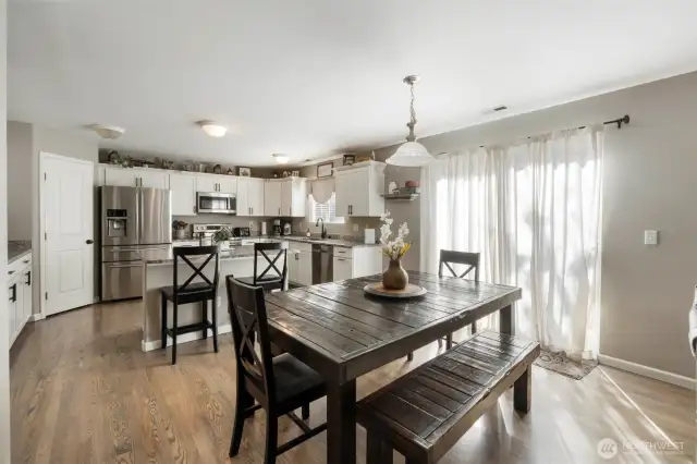 Beautiful, updated kitchen! Walk -in pantry, stainless steel appliances, granite counters, eat-bar island and the perfect spot for a cute farm table. Slider leads you out to the backyard for a great place to BBQ!