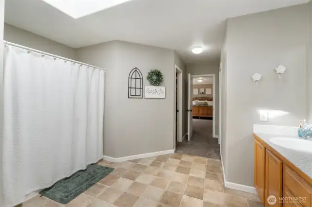 Walk-in closets flank each side as you enter the massive Primary bathroom.