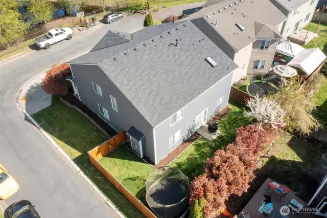 Aerial views show the fenced backyard and well-maintained landscaping. Located on a dead-end street with minimal traffic.