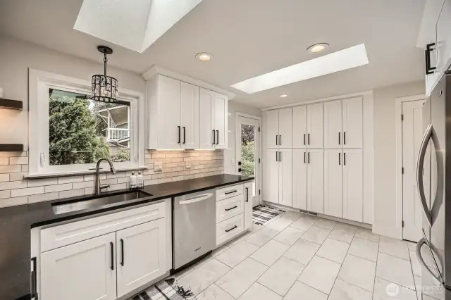 Lots of natural light and new cabinets throughout kitchen w/ tons of storage