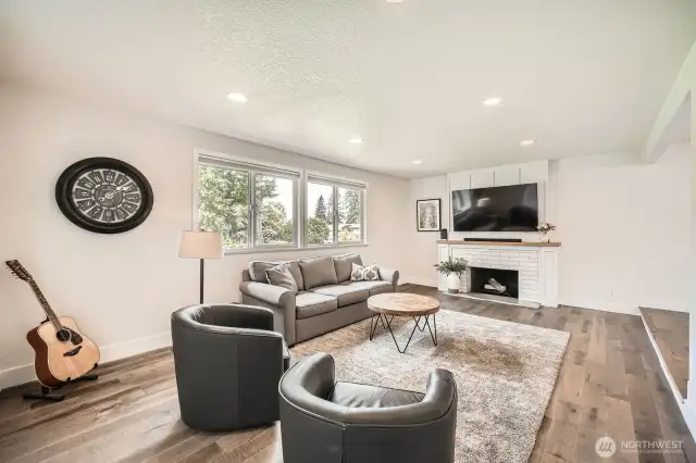 Spacious main floor living room with new hardwood floors