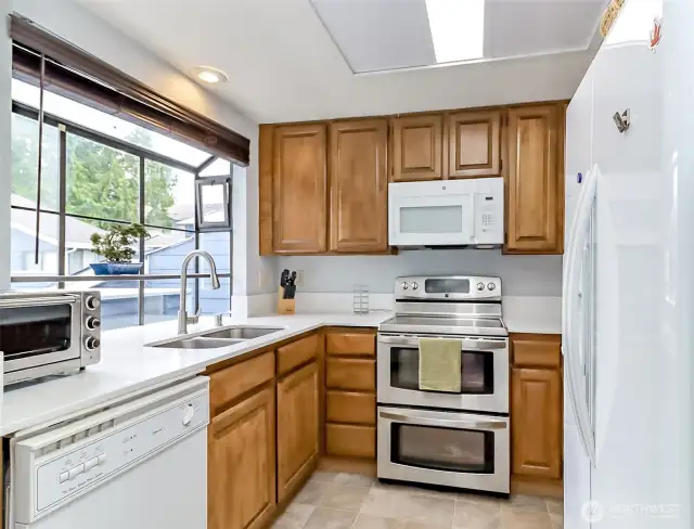 Kitchen has great space, plenty of cupboards AND that window! Grow your indoor herb garden here.