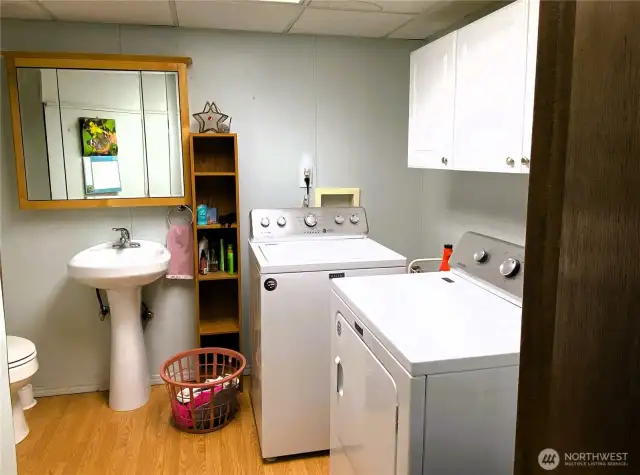 Convenient attached half bath and laundry in rec space.