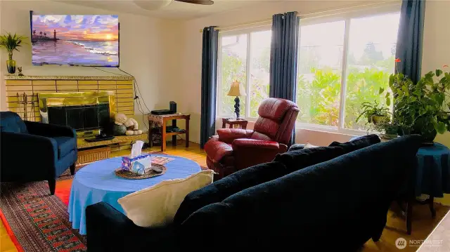 Cozy great room with wood-burning fireplace.