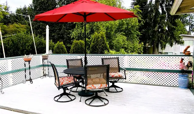 Overlooks a lush yard with mature landscaping.