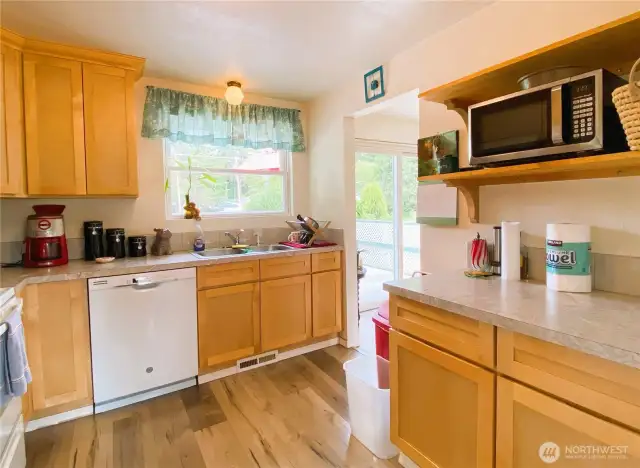 Bright kitchen with updated cabinets and flooring.