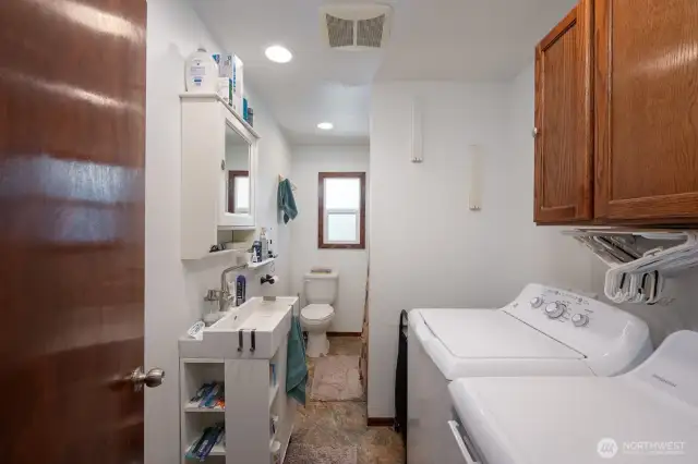 Laundry and full bath combo.