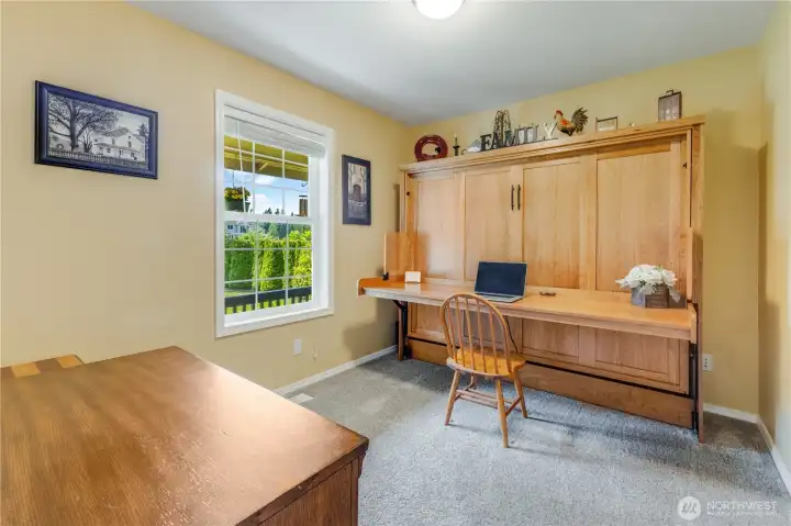 Main floor bedroom with closet and views of front yard. Trundle bed is negotiable.