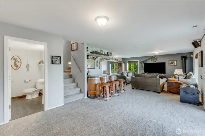 Lower Level Great Room with built-in bar & 1/2 Bath. New Carpet