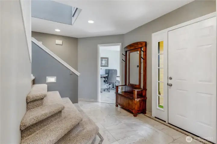 Open & Bright Entry is inviting. Beautiful custom glass inlay tiles creates a distinctive separation feel to the space Open & Bright Entry is inviting. Beautiful custom glass inlay tiles creates a distinctive separation feel to the space