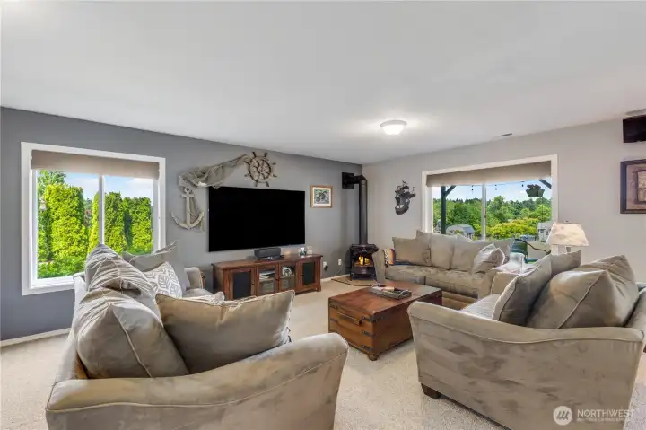 Lower Level is bright and open with gas fireplace, high ceilings and leads to back covered patio. Couches are negotiable