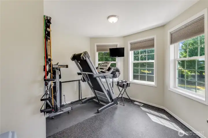 Bonus room upstairs has duel window shades, flooring is cork board. Carpet and pad are available to re-install if needed