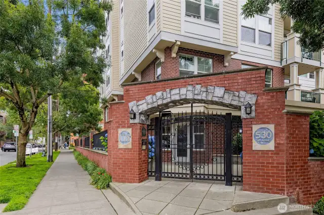 Secure entry into IV West. Built in 2003, the building offers modern living while its brick facade complements the classic charm of Queen Anne.
