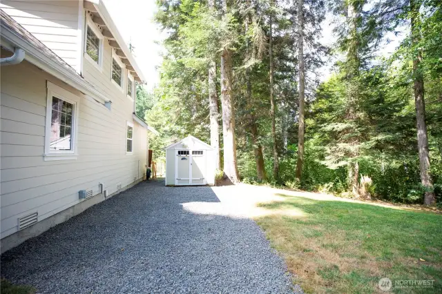 Outbuilding for storage and RV parking with electrical hookup.