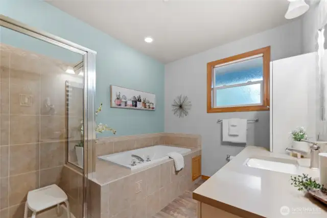 Primary Bathroom with shower and jetted tub.