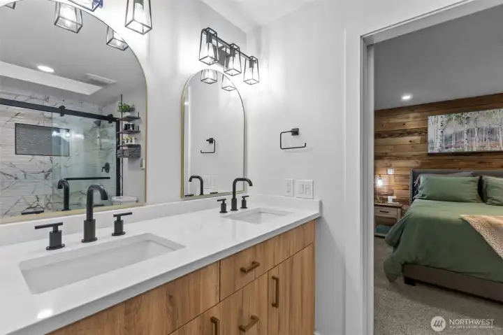 Newly updated primary bathroom with modern finishes, heated floors and a spa-like feel.