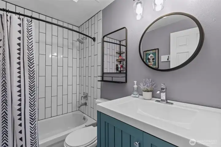 Updated bathrooms throughout add to the home’s fresh, modern feel.