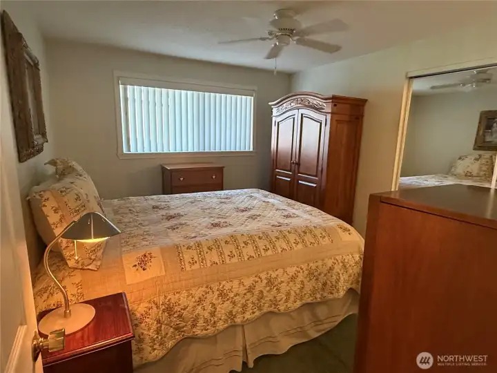 Primary bedroom and 3/4 bath at the end of the closet.