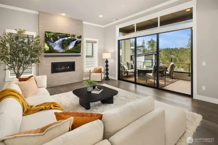 Grand Living space with Stacking Slider opening to the front deck