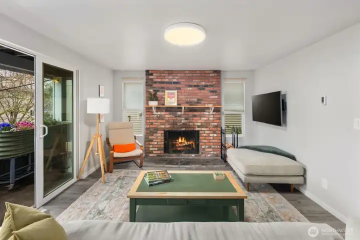 Living room features wood burning fireplace