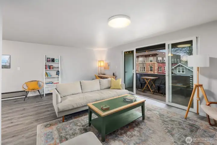 Living room with sliding door access to large deck
