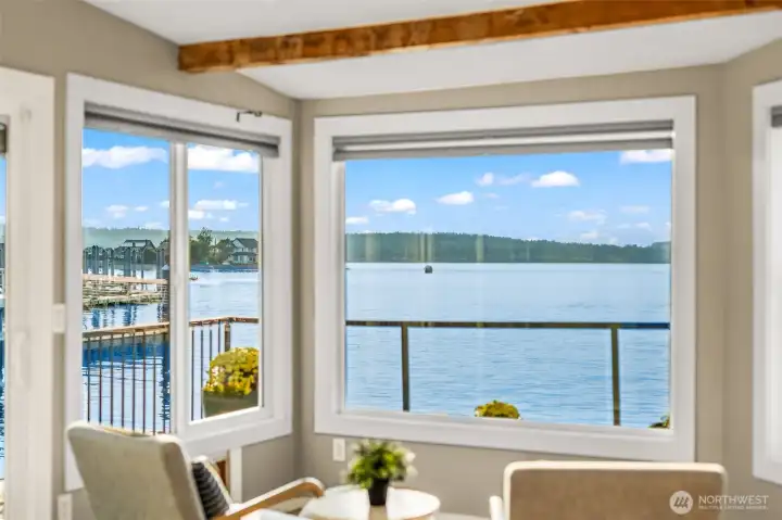 Open living spaces framed by large windows, maximizing natural light and waterfront views.
