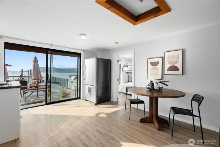 Casual dining nook with views to the deck and water beyond