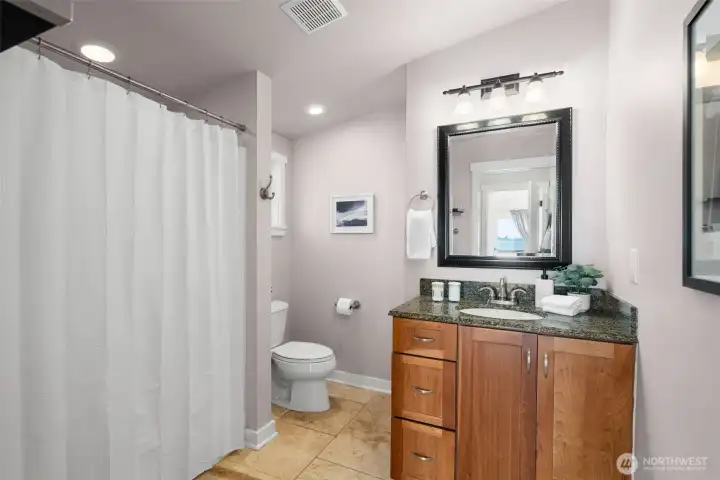 Updated bathroom with clean finishes and functional design.