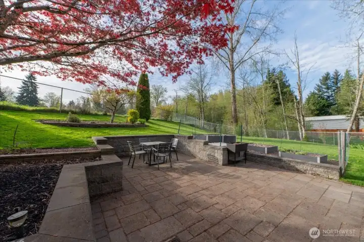 Beautiful retaining wall provides extra seating.