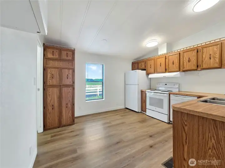 Bright and light kitchen with functional workspace and appliances are included.