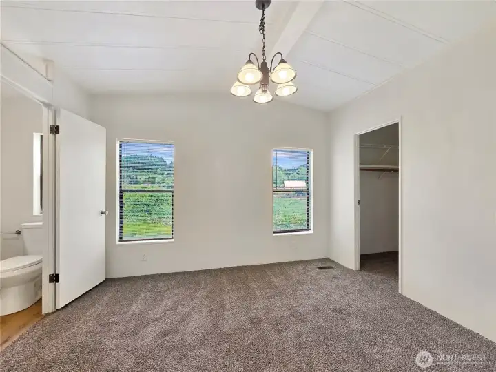 Enjoy quiet pasture views from the comfort of the primary bedroom.