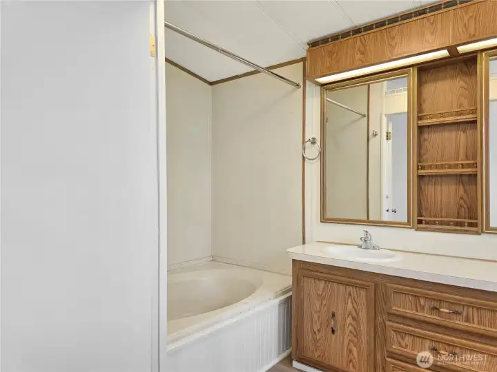 Oversized soaking tub creates a relaxing retreat in the primary bath.