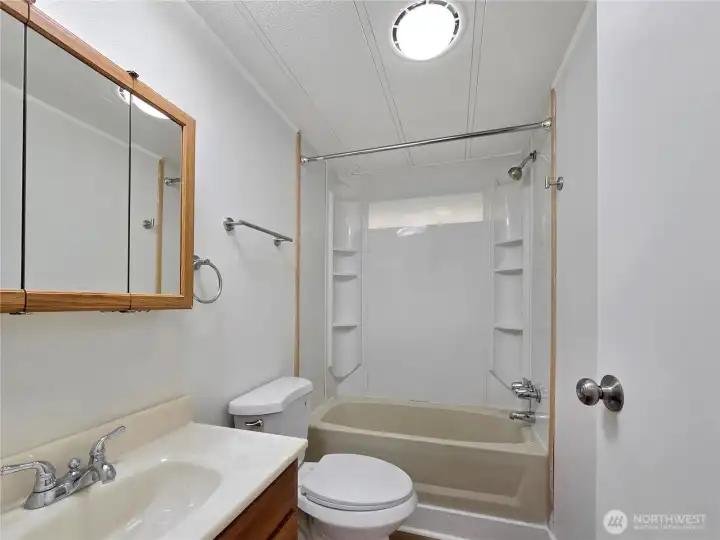Full hall bath conveniently located for guests and everyday use