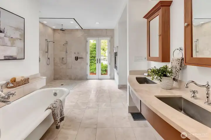 Limestone counters surround two sinks in spacious Primary Bath!
