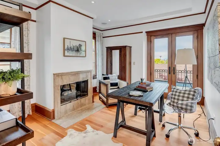 Second floor bedroom (non conforming) with gas fireplace, fir floors, french doors to view deck!