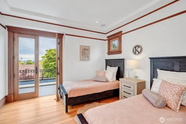 Another non conforming bedroom on second floor with fir floors, lovely moulding, french doors to view deck!