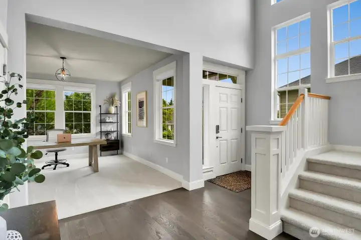 A formal living room or den greets you as you enter this light-filled home. New paint throughout!