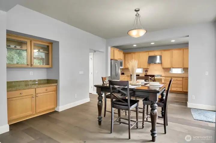 A built-in bar accentuates the dining area. Notice the new paint and flooring!