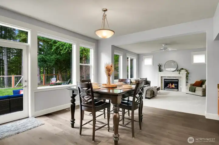 A seamless blend of kitchen, dining and family room. All overlooking the gorgeous yard and greenbelt.