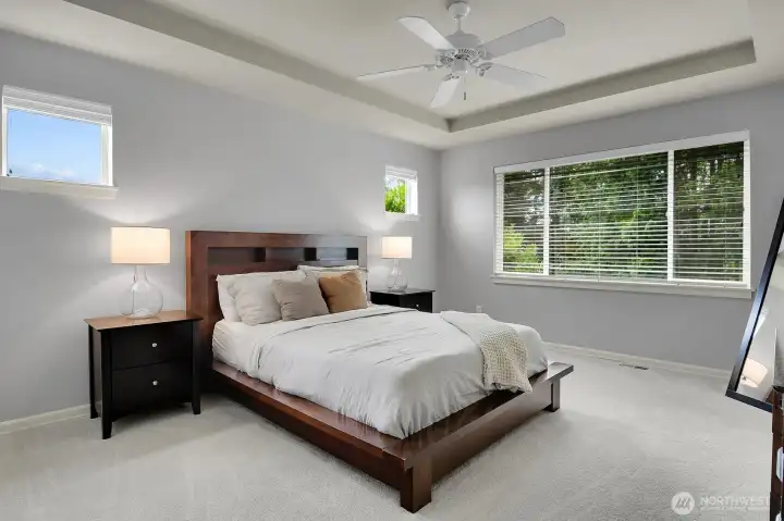 Primary bedroom overlooks the protected greenbelt.