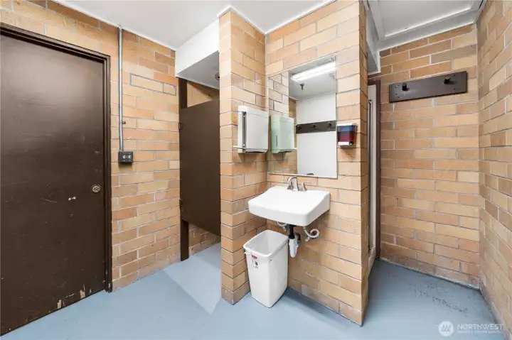 Convenient community shower and restroom located adjacent to the pool and sauna.