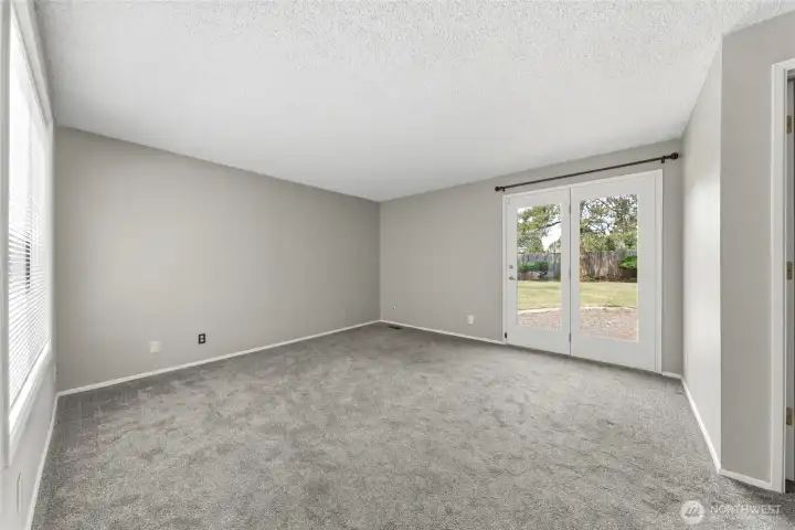 Primary Bdrm with Patio doors to private backyard