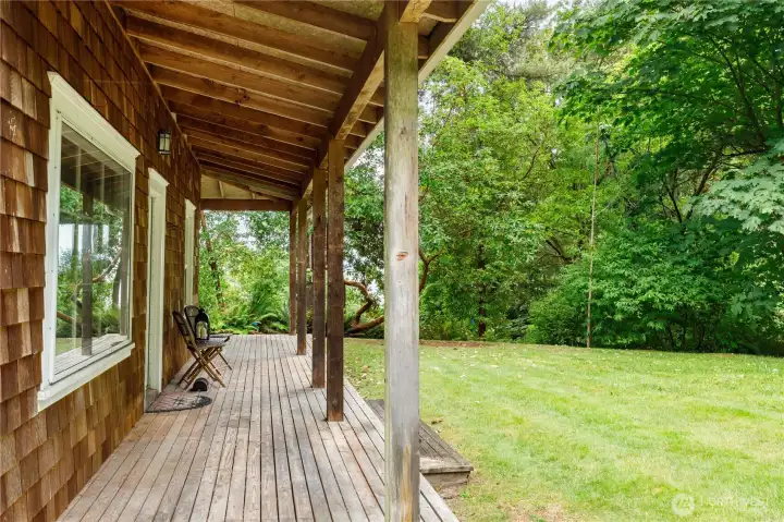 The covered porch wraps partially around. Great for rainy and sunny days alike. The covered porch wraps partially around. Great for rainy and sunny days alike.