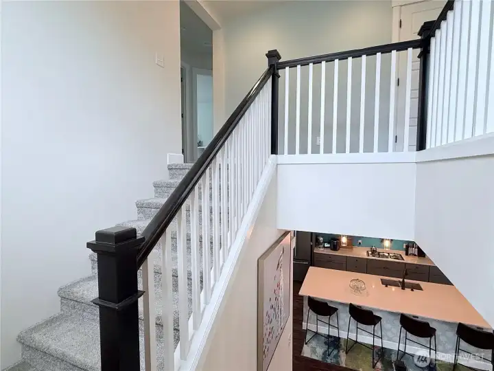 Upstairs - loft and primary to the right, three bedrooms to the left