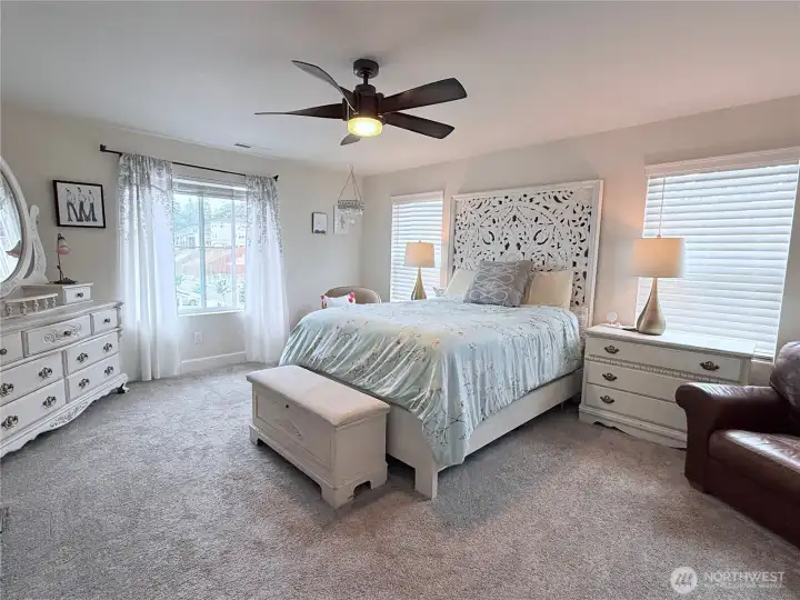 Primary bedroom on the street side of the house, with more views