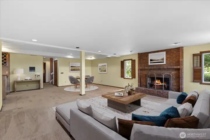 Lower level family room AI staged with wood burning fireplace